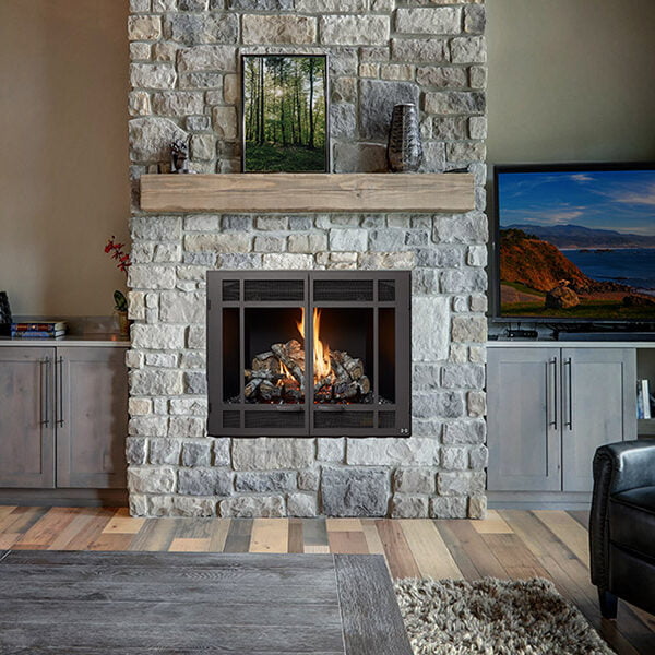 Living room luxury interior with large stone fireplace and leath